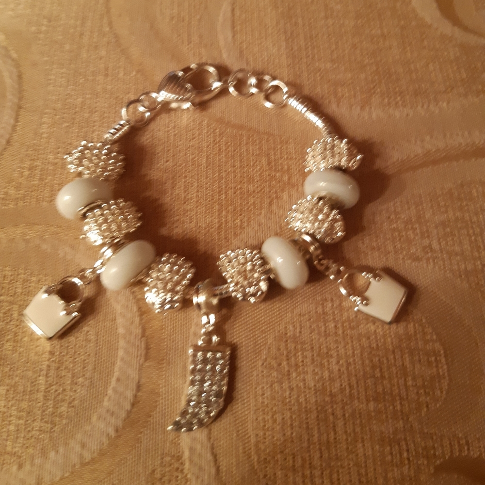Silver tone charm braclet